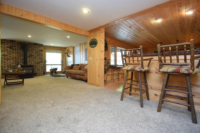 27625 Clear Sky Rd, Jackson Twp, WI 54893 - bar featuring carpet flooring, a wood stove, wood walls, and recessed lighting