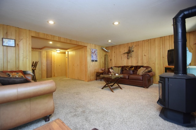 27625 Clear Sky Rd, Jackson Twp, WI 54893 - living area with a wood stove, wood walls, carpet flooring, and recessed lighting