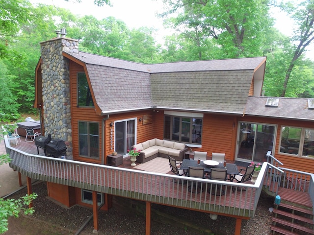 27625 Clear Sky Rd, Jackson Twp, WI 54893 - rear view of house featuring a shingled roof, a gambrel roof, and a deck