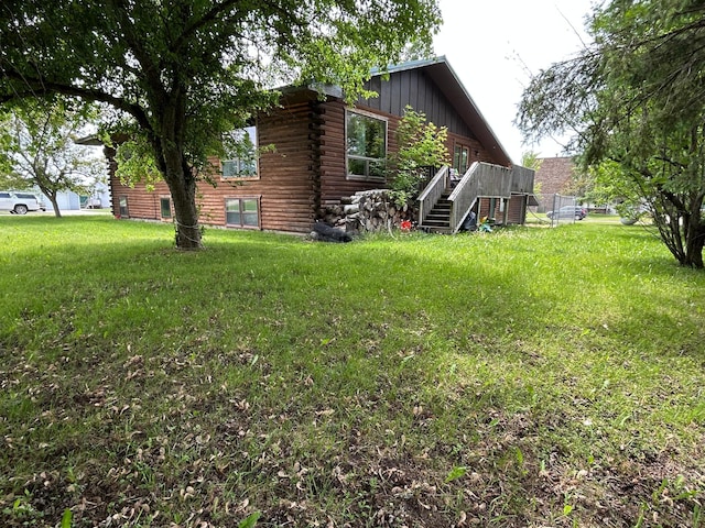 140 Northern Ave NW, Blackduck, MN 56630 - rear view of house with log siding and a yard
