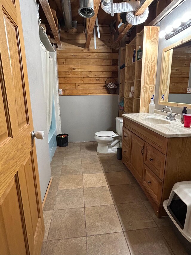 140 Northern Ave NW, Blackduck, MN 56630 - bathroom with vanity, shower / bathtub combination with curtain, wood walls, and stone finish floors