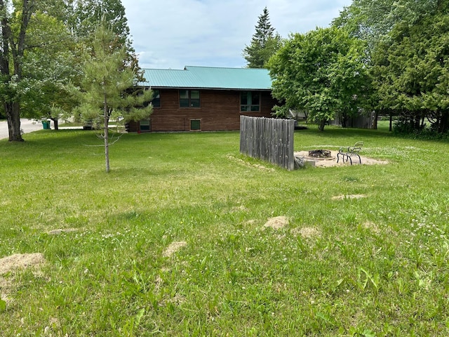 140 Northern Ave NW, Blackduck, MN 56630 - view of green lawn featuring a fire pit