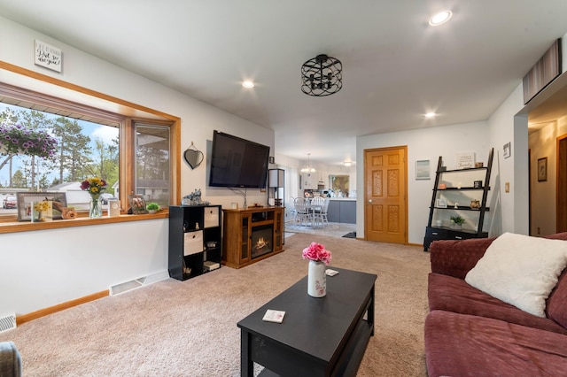 1609 Doddridge Ave, Cloquet, MN 55720 - living area featuring light colored carpet, recessed lighting, baseboards, and a chandelier
