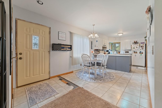 1609 Doddridge Ave, Cloquet, MN 55720 - foyer entrance featuring a chandelier, light tile patterned flooring, and baseboards