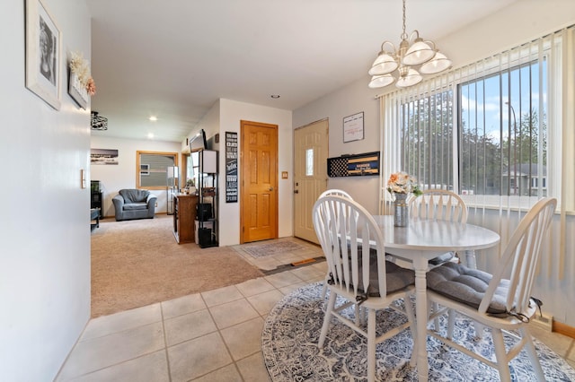 1609 Doddridge Ave, Cloquet, MN 55720 - carpeted dining space featuring a chandelier, tile patterned flooring, and recessed lighting
