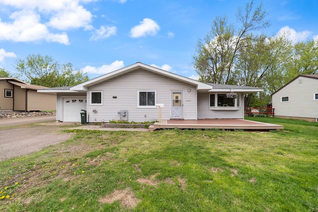 1609 Doddridge Ave, Cloquet, MN 55720 - ranch-style house with a garage, driveway, a deck, and a front lawn