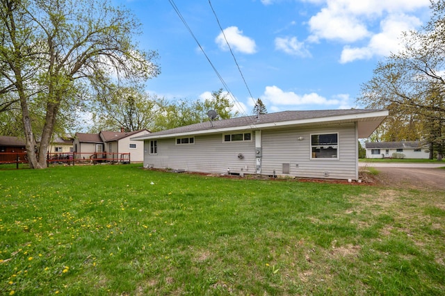 1609 Doddridge Ave, Cloquet, MN 55720 - back of house featuring a yard