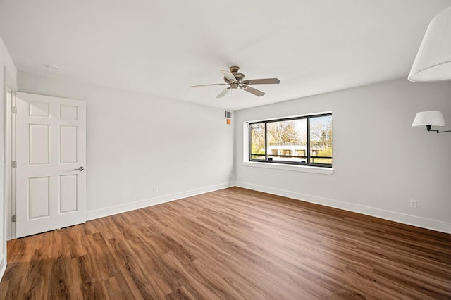 2885 Knox Ave S Unit 202, Minneapolis, MN 55408 - spare room featuring wood finished floors, a ceiling fan, and baseboards