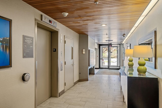 2885 Knox Ave S Unit 202, Minneapolis, MN 55408 - hall featuring wooden ceiling, elevator, and baseboards