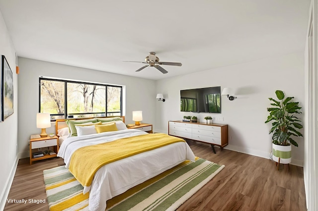 2885 Knox Ave S Unit 202, Minneapolis, MN 55408 - bedroom featuring wood finished floors, baseboards, and a ceiling fan