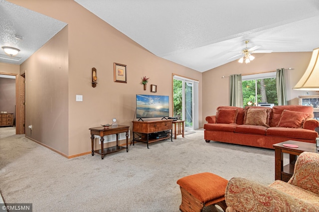 914 106th Ave NW, Coon Rapids, MN 55433 - living area featuring carpet flooring, lofted ceiling, a textured ceiling, healthy amount of natural light, and a ceiling fan