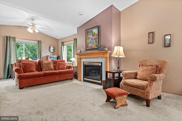 914 106th Ave NW, Coon Rapids, MN 55433 - carpeted living room featuring vaulted ceiling, a tile fireplace, and ceiling fan