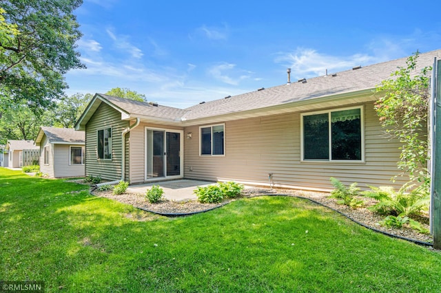 914 106th Ave NW, Coon Rapids, MN 55433 - rear view of property featuring a patio area, a lawn, and a shingled roof