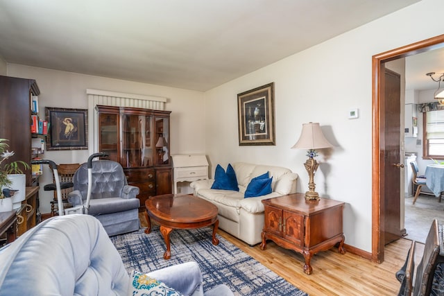 115 7th Ave S, Crookston, MN 56716 - living room featuring light wood-style floors and baseboards