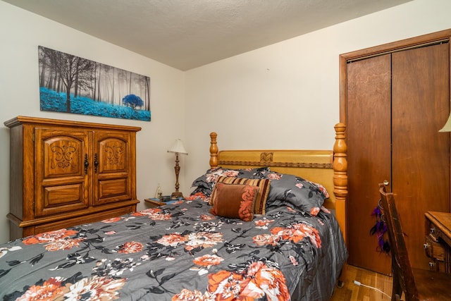 115 7th Ave S, Crookston, MN 56716 - bedroom featuring wood finished floors and a closet