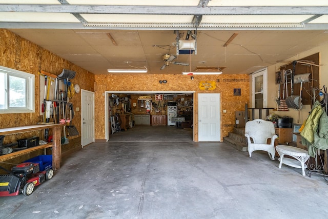 115 7th Ave S, Crookston, MN 56716 - garage with a workshop area and a garage door opener
