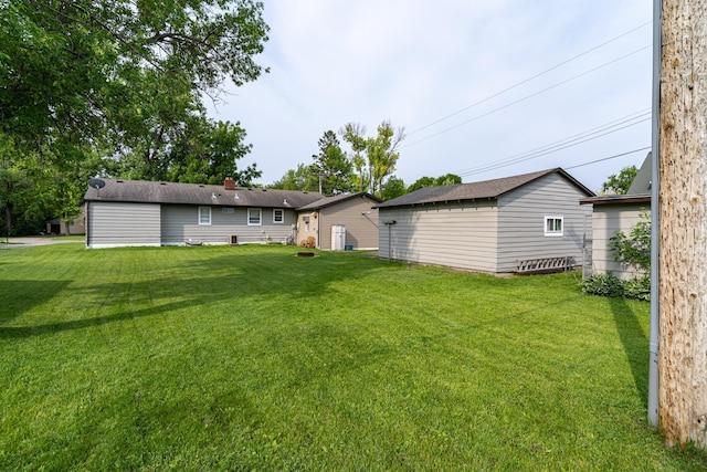 115 7th Ave S, Crookston, MN 56716 - rear view of property featuring a lawn