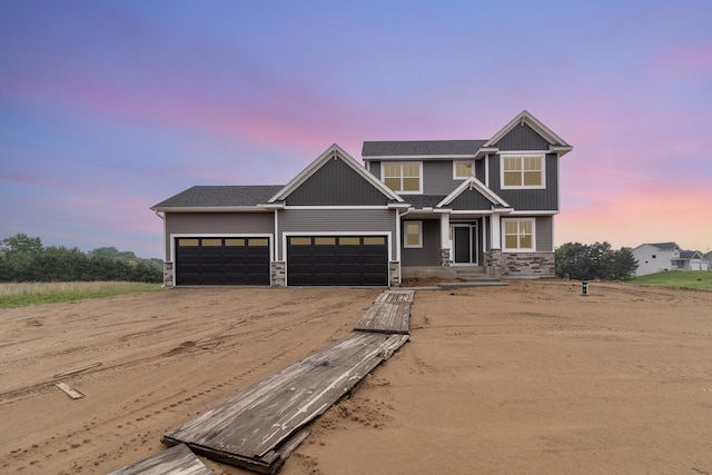 20610 Redwood St NW, Oak Grove, MN 55011 - craftsman-style house with driveway, stone siding, and an attached garage