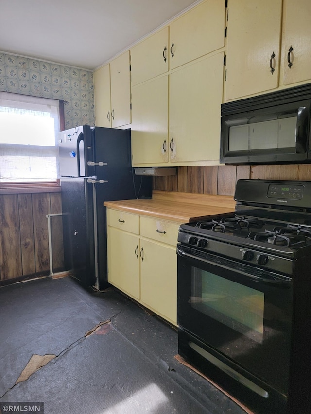 203 Ann Ave E, Clarissa, MN 56440 - kitchen with black appliances, cream cabinetry, and light countertops