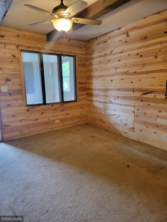 203 Ann Ave E, Clarissa, MN 56440 - carpeted spare room featuring wooden walls, a ceiling fan, and a textured ceiling