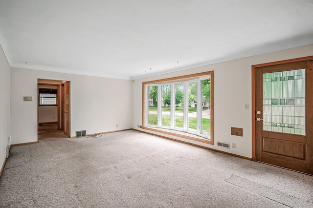 800 82nd Ave N, Brooklyn Park, MN 55444 - unfurnished living room featuring baseboards and carpet floors