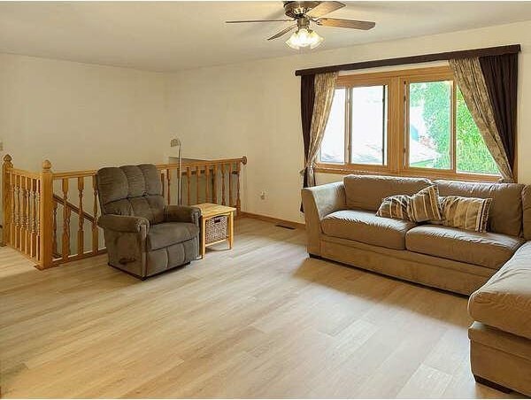 861 Lake Susan Dr, Chanhassen, MN 55317 - living area featuring light wood-type flooring and ceiling fan
