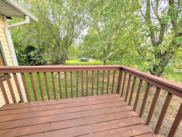861 Lake Susan Dr, Chanhassen, MN 55317 - wooden deck featuring a trampoline and a yard