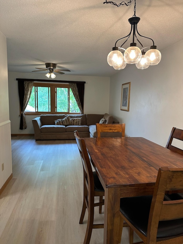 861 Lake Susan Dr, Chanhassen, MN 55317 - dining space featuring a ceiling fan, light wood-type flooring, and a textured ceiling