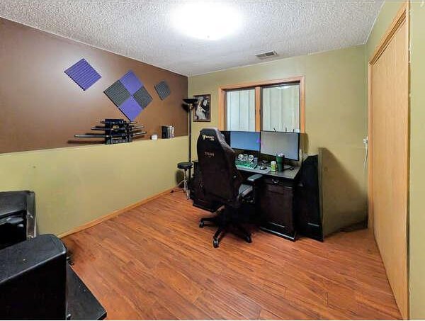 861 Lake Susan Dr, Chanhassen, MN 55317 - office featuring a textured ceiling and wood finished floors