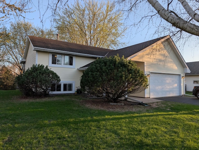 861 Lake Susan Dr, Chanhassen, MN 55317 - view of front of house with asphalt driveway, a garage, a front yard, and a shingled roof