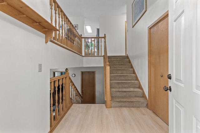 861 Lake Susan Dr, Chanhassen, MN 55317 - staircase with wood finished floors and a high ceiling