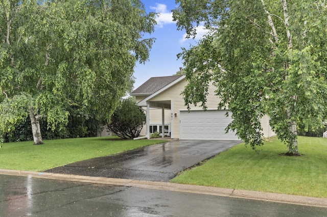 861 Lake Susan Dr, Chanhassen, MN 55317 - view of property hidden behind natural elements featuring driveway, a front lawn, and an attached garage