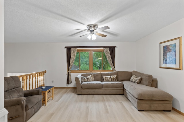 861 Lake Susan Dr, Chanhassen, MN 55317 - living area with a ceiling fan, light wood finished floors, and a textured ceiling