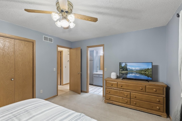861 Lake Susan Dr, Chanhassen, MN 55317 - bedroom featuring light carpet, a textured ceiling, a closet, ceiling fan, and connected bathroom