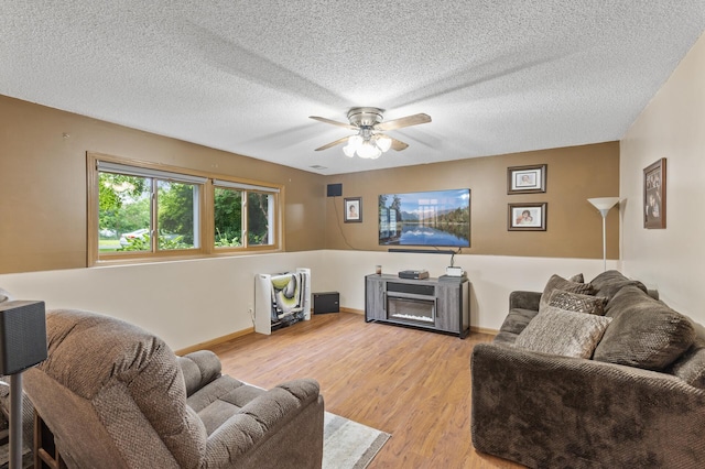 861 Lake Susan Dr, Chanhassen, MN 55317 - living room featuring light wood-style flooring, ceiling fan, and a textured ceiling