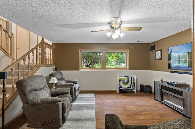 861 Lake Susan Dr, Chanhassen, MN 55317 - living room featuring a ceiling fan, a textured ceiling, stairway, and wood finished floors