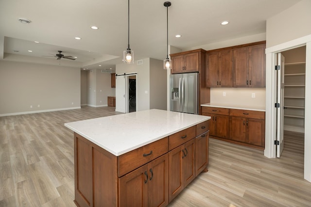 1202 15th St NE, Kasson, MN 55944 - kitchen featuring stainless steel refrigerator with ice dispenser, light wood-style floors, recessed lighting, a barn door, and a center island