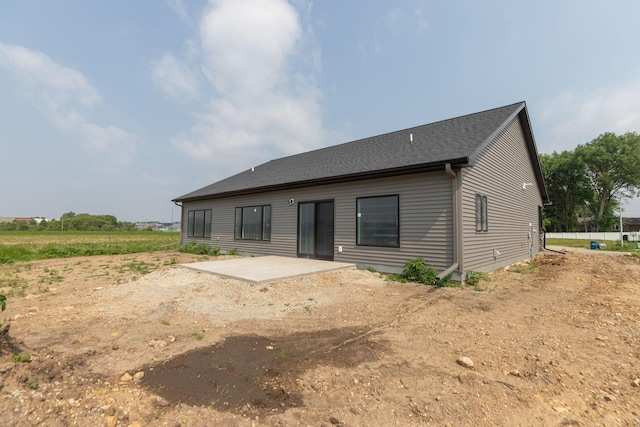 1202 15th St NE, Kasson, MN 55944 - rear view of property featuring a patio and roof with shingles