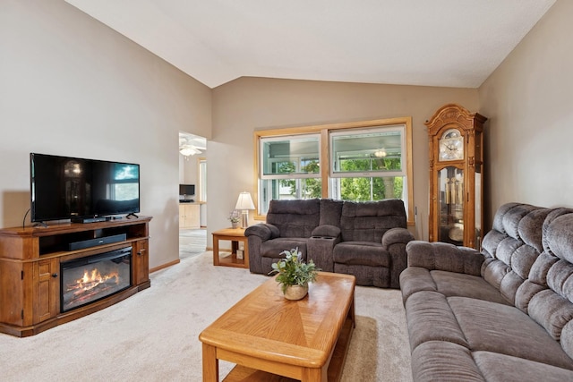 3726 Gershwin Ln N, Oakdale, MN 55128 - living room featuring carpet floors, vaulted ceiling, and a glass covered fireplace