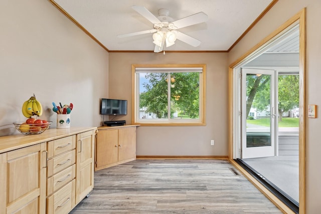 3726 Gershwin Ln N, Oakdale, MN 55128 - kitchen with light brown cabinets, ornamental molding, light wood-style flooring, a ceiling fan, and light countertops