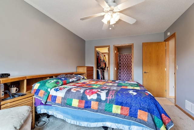 3726 Gershwin Ln N, Oakdale, MN 55128 - carpeted bedroom featuring a closet, a spacious closet, and a ceiling fan