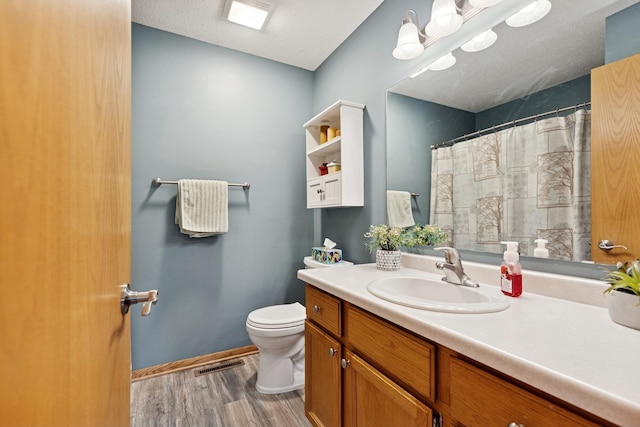 3726 Gershwin Ln N, Oakdale, MN 55128 - full bath with wood finished floors, vanity, and curtained shower