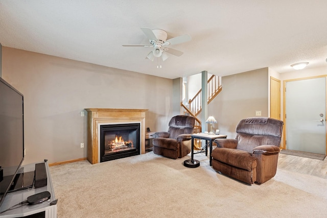 3726 Gershwin Ln N, Oakdale, MN 55128 - living room with carpet floors, stairs, a ceiling fan, and a glass covered fireplace