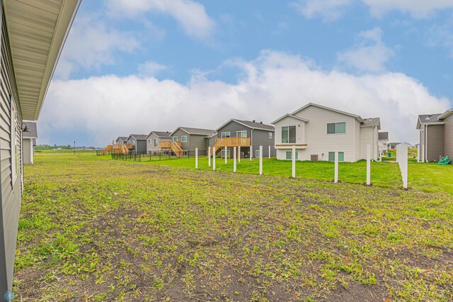 6614 68th St S, Horace, ND 58047 - view of grassy yard with a residential view and a deck