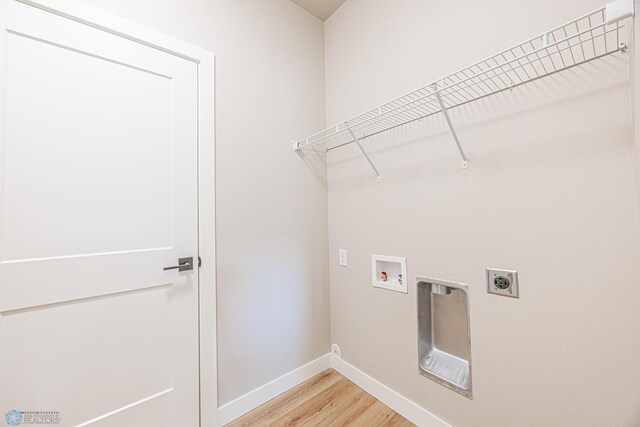 6614 68th St S, Horace, ND 58047 - washroom with electric dryer hookup, light wood-type flooring, and washer hookup