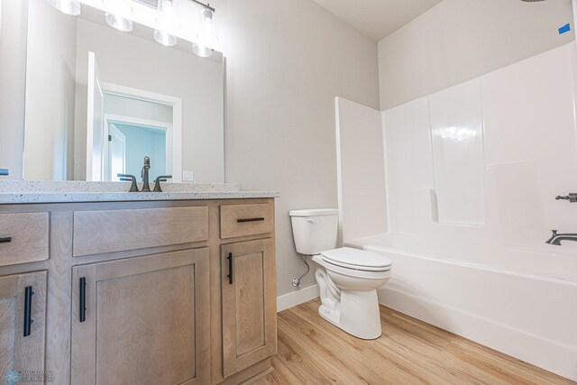 6614 68th St S, Horace, ND 58047 - bathroom featuring wood finished floors, vanity, and shower / bathtub combination