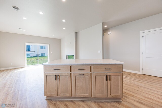 6614 68th St S, Horace, ND 58047 - kitchen featuring light wood-style flooring, a center island, recessed lighting, and open floor plan