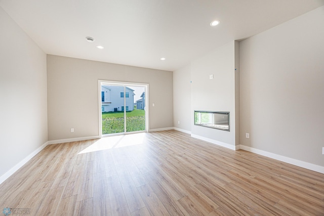 6614 68th St S, Horace, ND 58047 - empty room with light wood-style flooring and recessed lighting