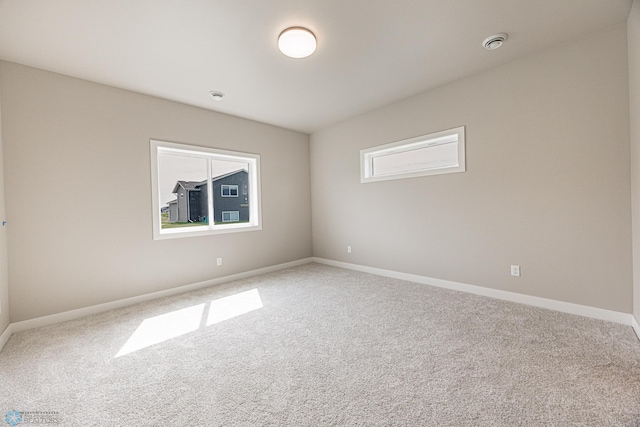 6614 68th St S, Horace, ND 58047 - carpeted empty room featuring a smoke detector and baseboards