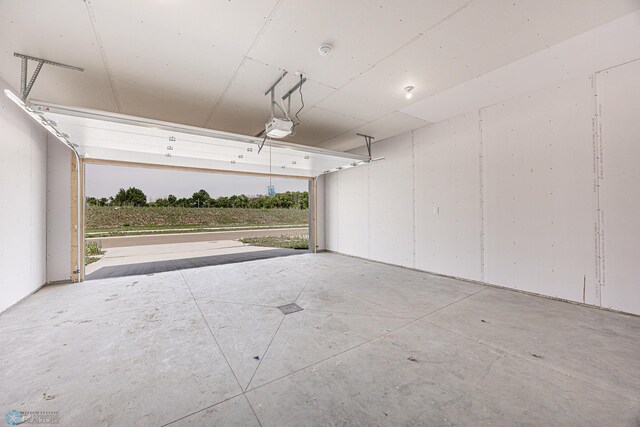 6614 68th St S, Horace, ND 58047 - garage featuring a garage door opener